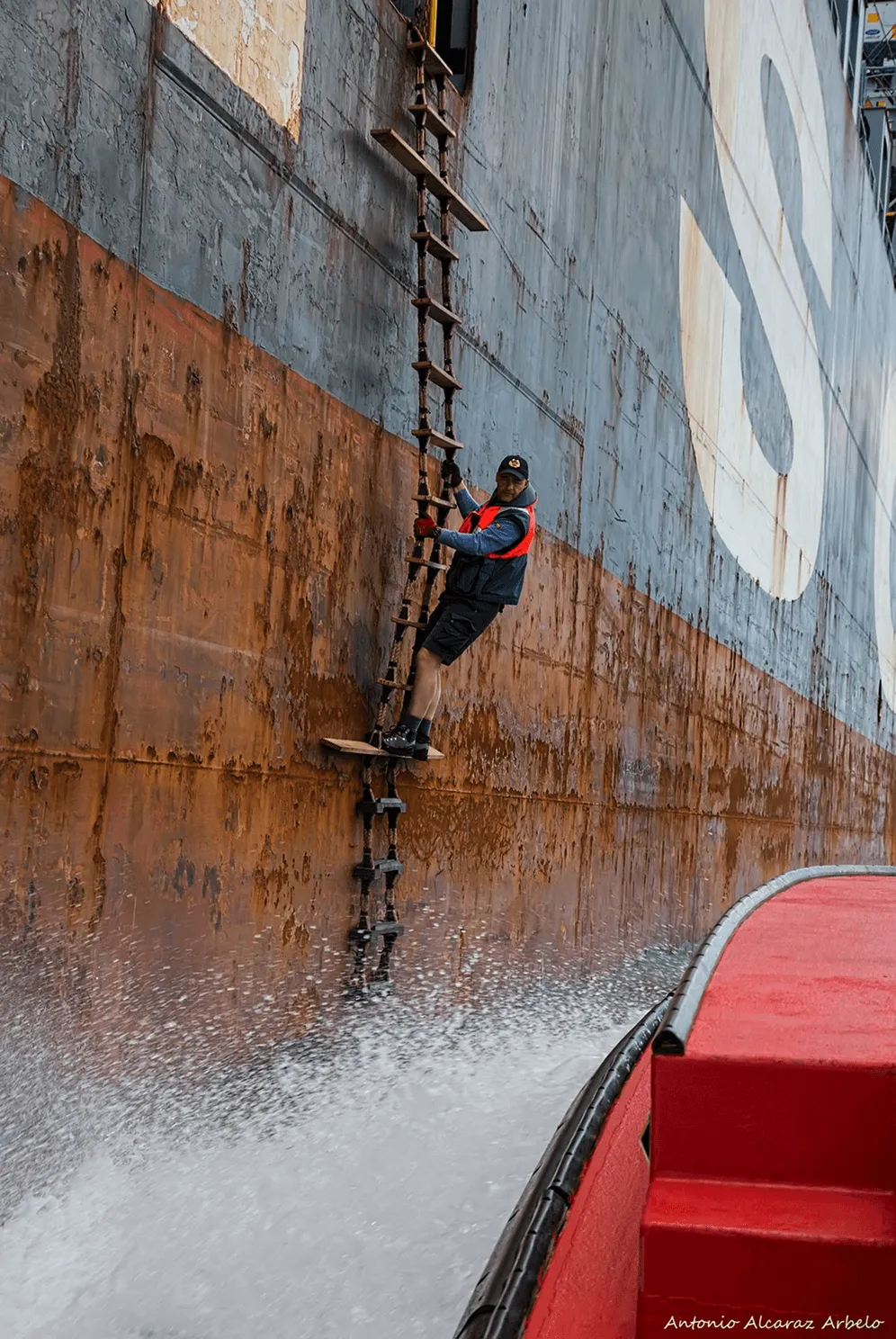 Crew member on ship ladder representing orchestration flow